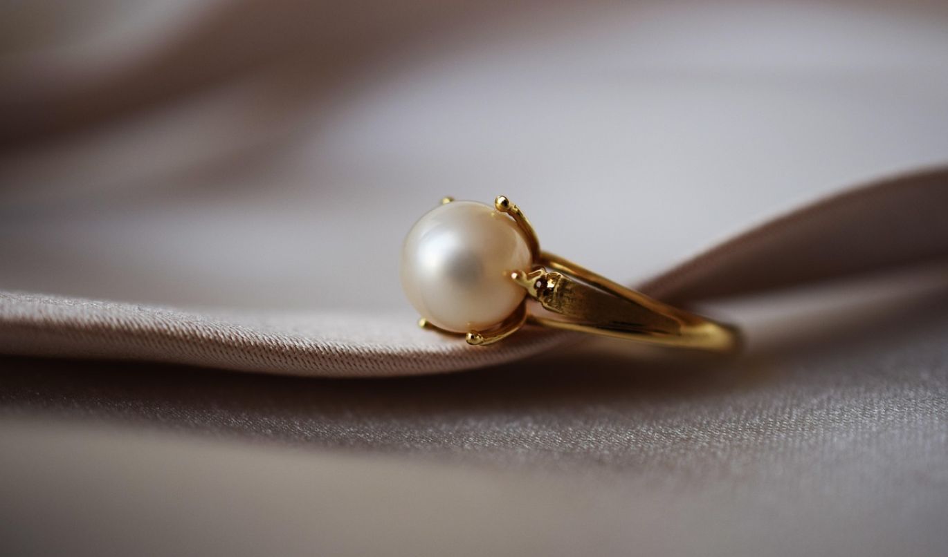 Close-up of various 14k gold findings for jewelry manufacturing, symbolizing sourcing from reliable manufacturers.