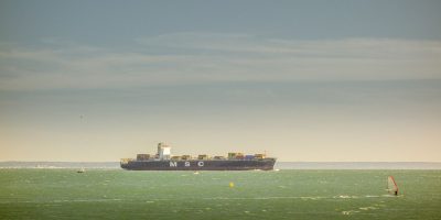 Graph showing fluctuating Base Metals Prices with global commodity trading imagery