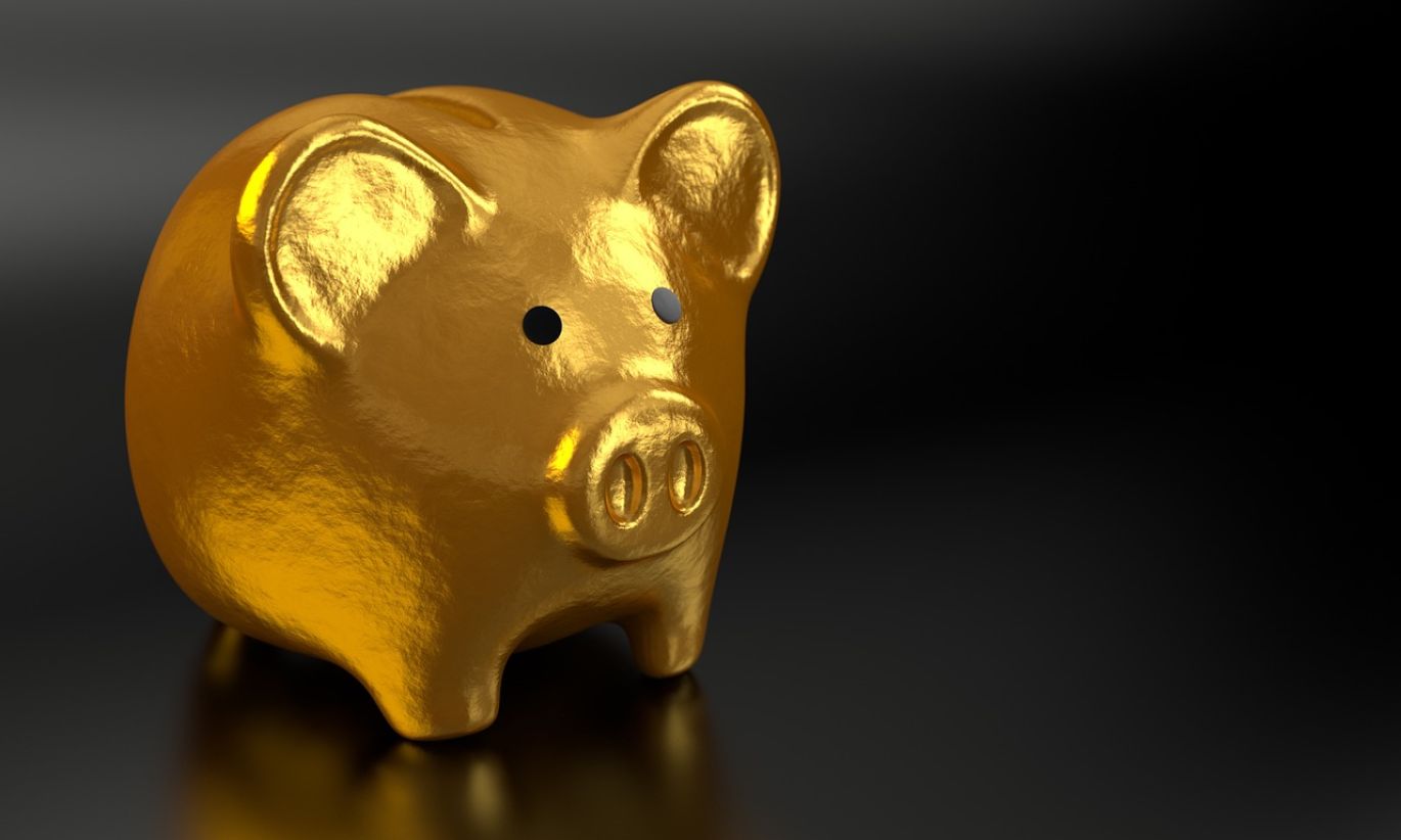 Best Gold Backed Ira - Stack of gold coins representing secure retirement investment.