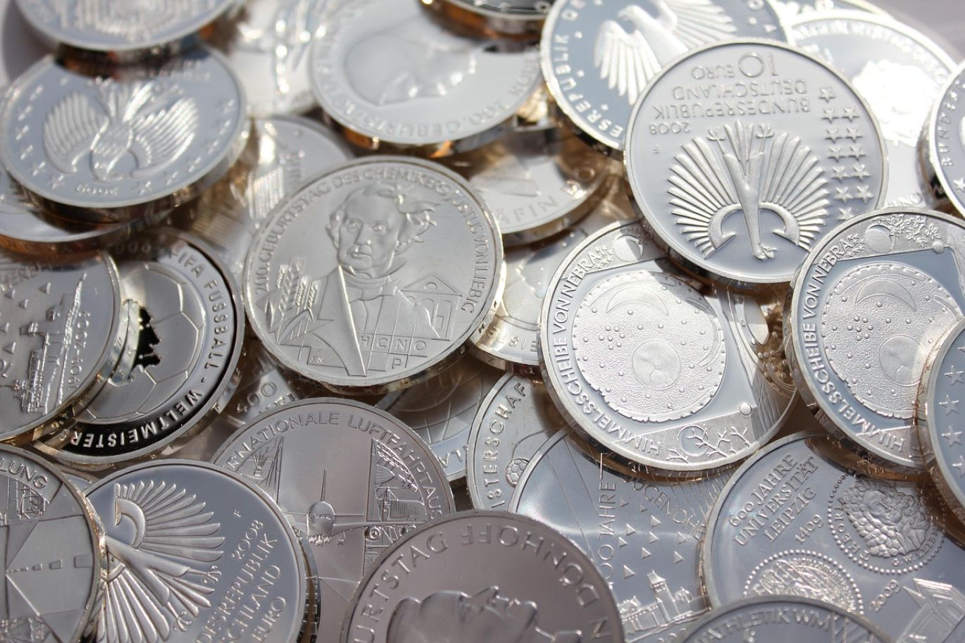 Close-up of gleaming silver coins, representing the best place to buy silver coins for investment.