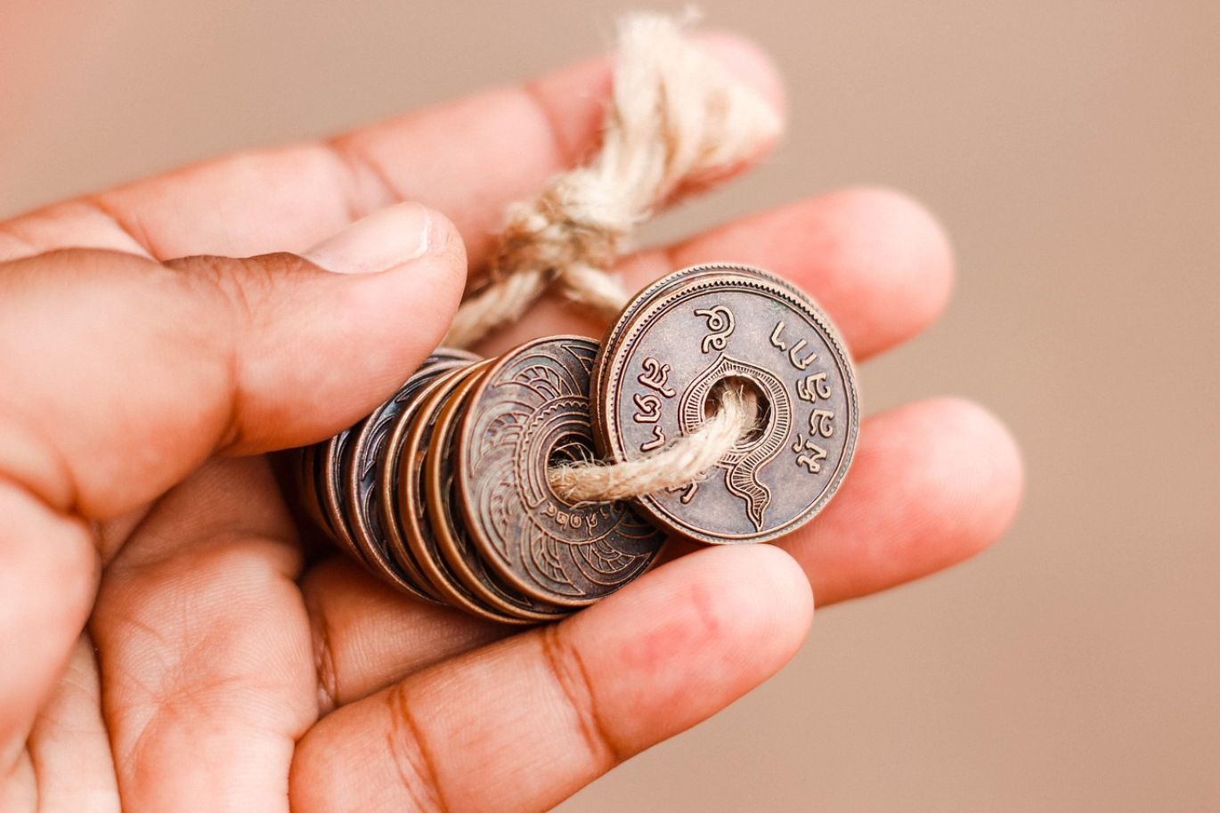 Gold coins being valued by a professional at Maiyam Group, the best place to sell gold coins in Kenya.