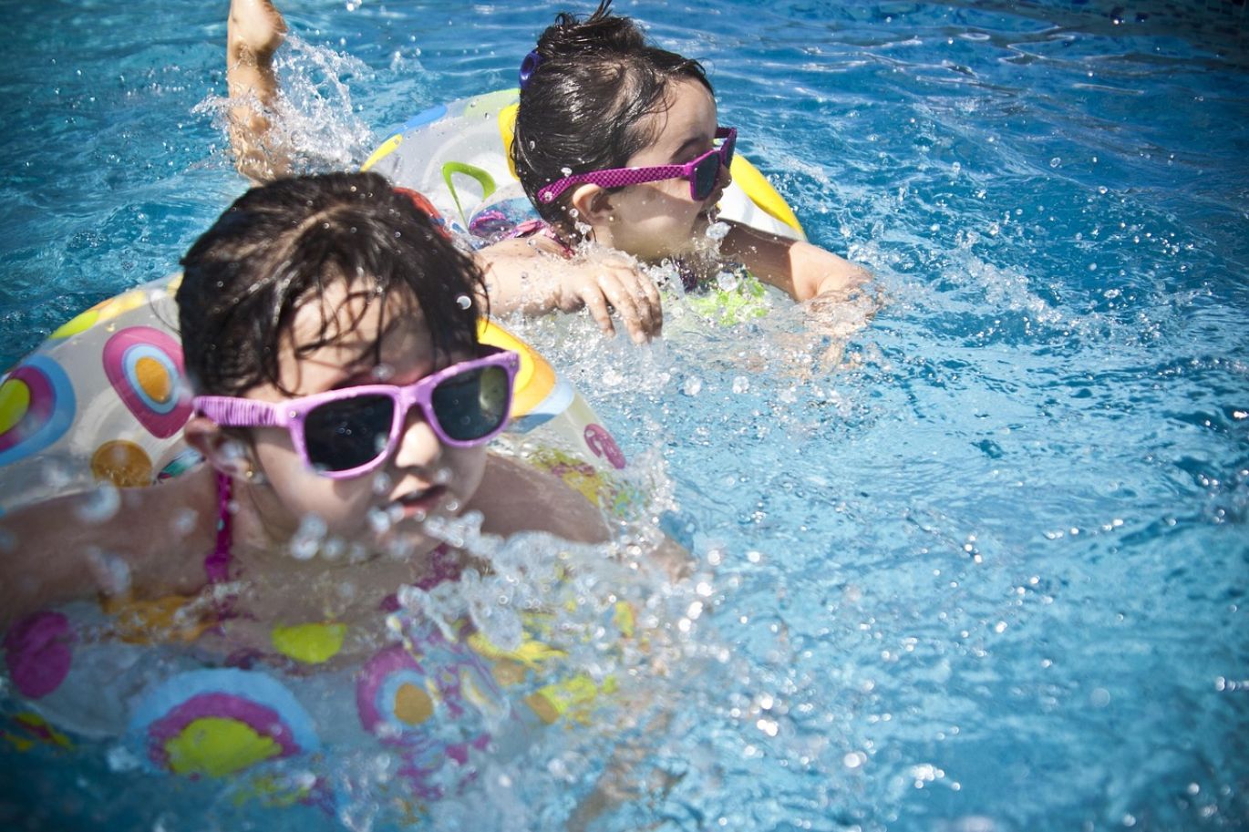Person testing pool water for bicarbonate soda balance
