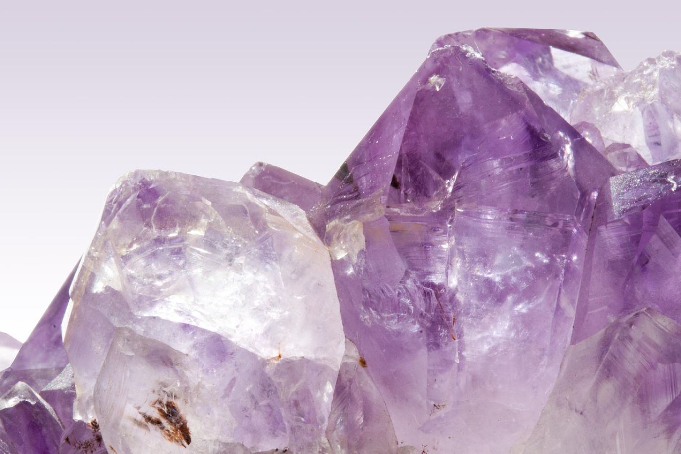 Close-up of rough, uncut Bulk Raw Amethyst crystals from Kenya, showcasing their natural purple hue.