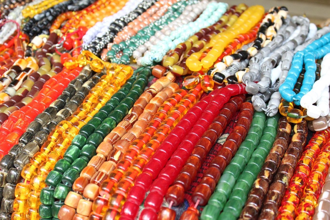 Assortment of colorful gemstone beads for sale in bulk, representing an opportunity to buy gemstone beads wholesale.