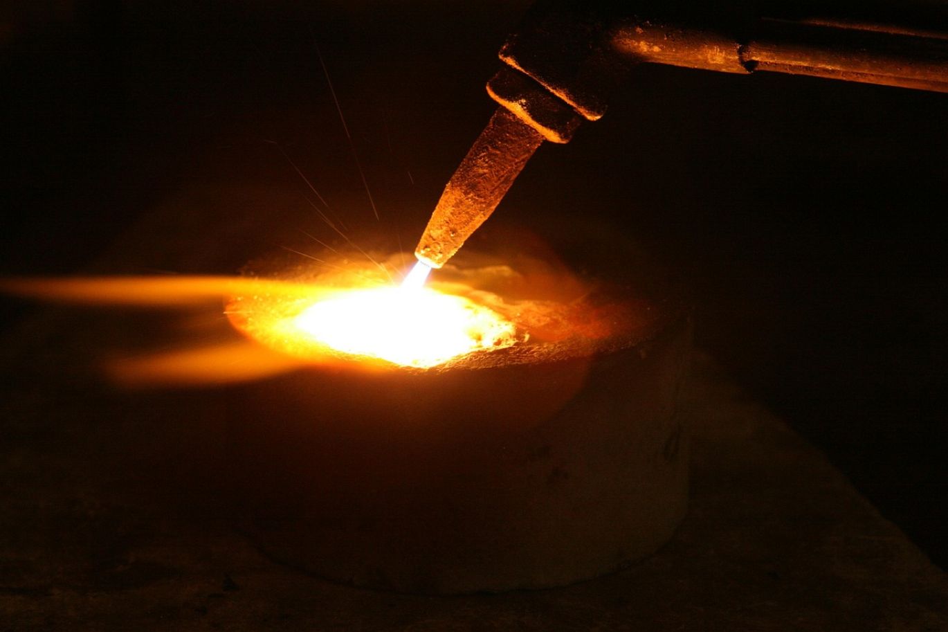 Industrial clay manufacturing process showing raw materials being processed and fired.