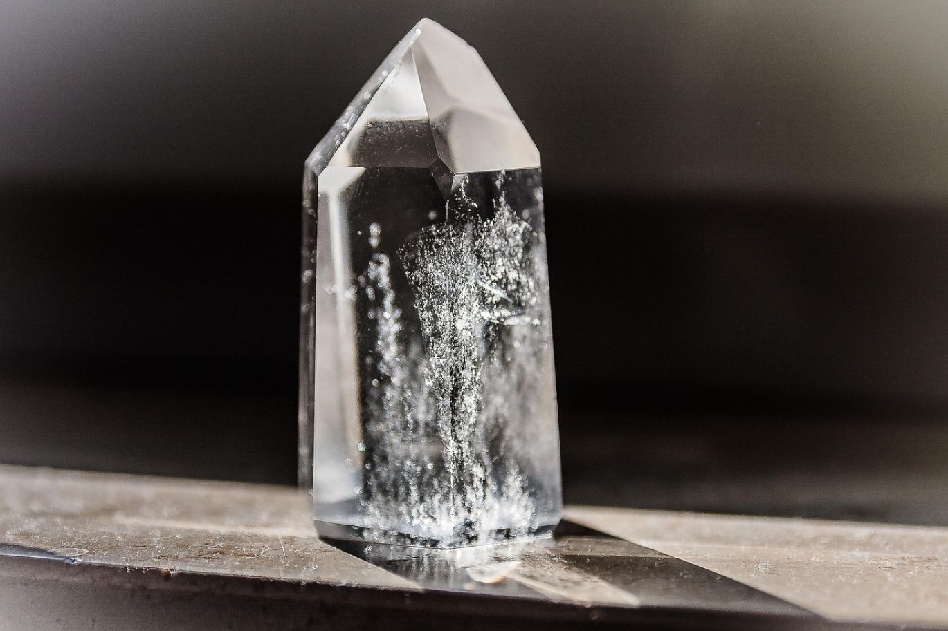 Vibrant collection of ethically sourced wholesale crystals displayed on a wooden surface.