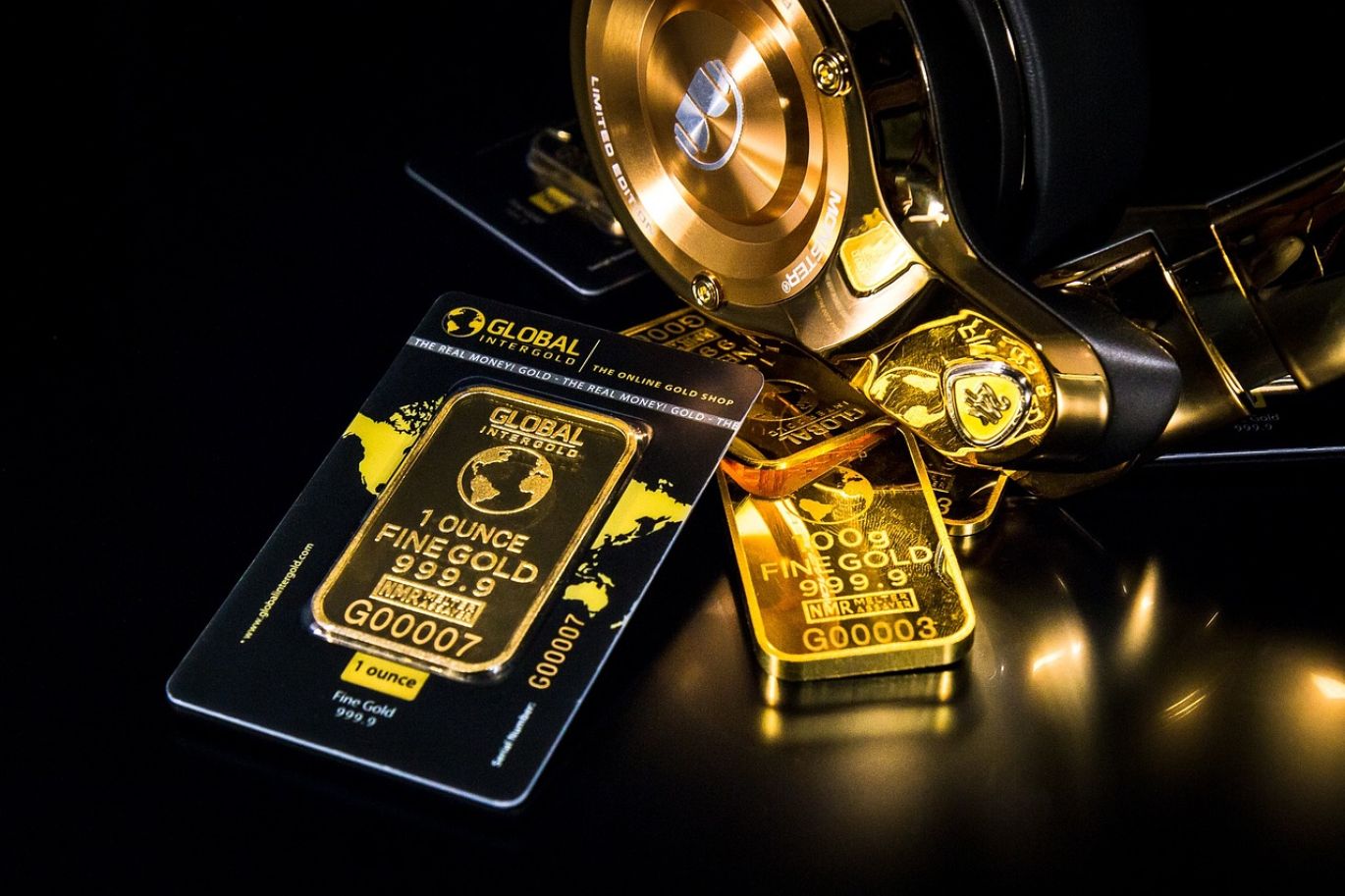 Gold bars and silver coins stacked, representing Gold And Silver Investment Companies in Kenya
