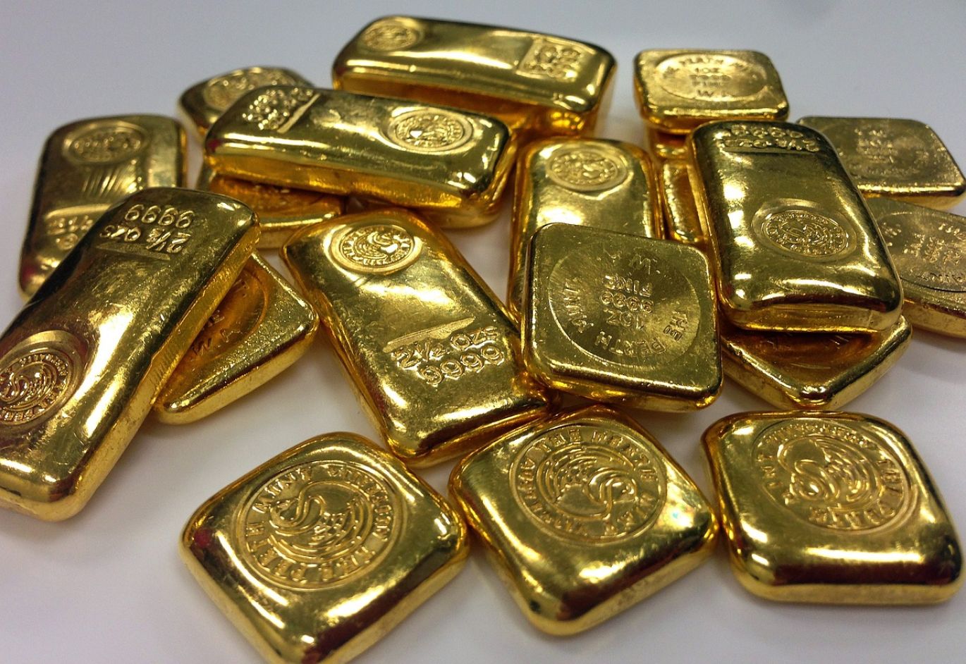 Gold bars stacked, representing Gold Bullion By Post service from Maiyam Group