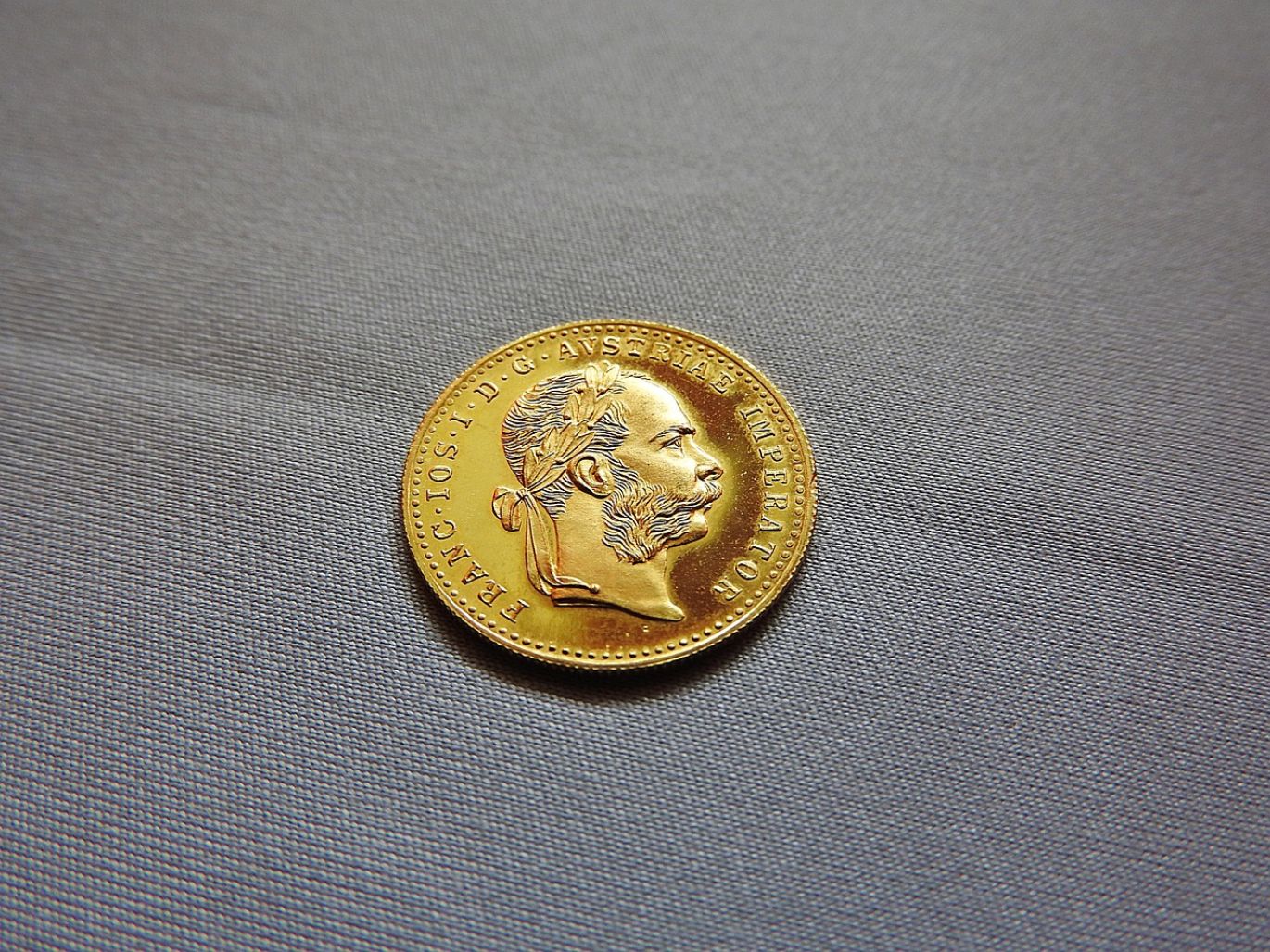 Several gold coins laid out for sale, symbolizing Gold Coins For Sale Cheap.