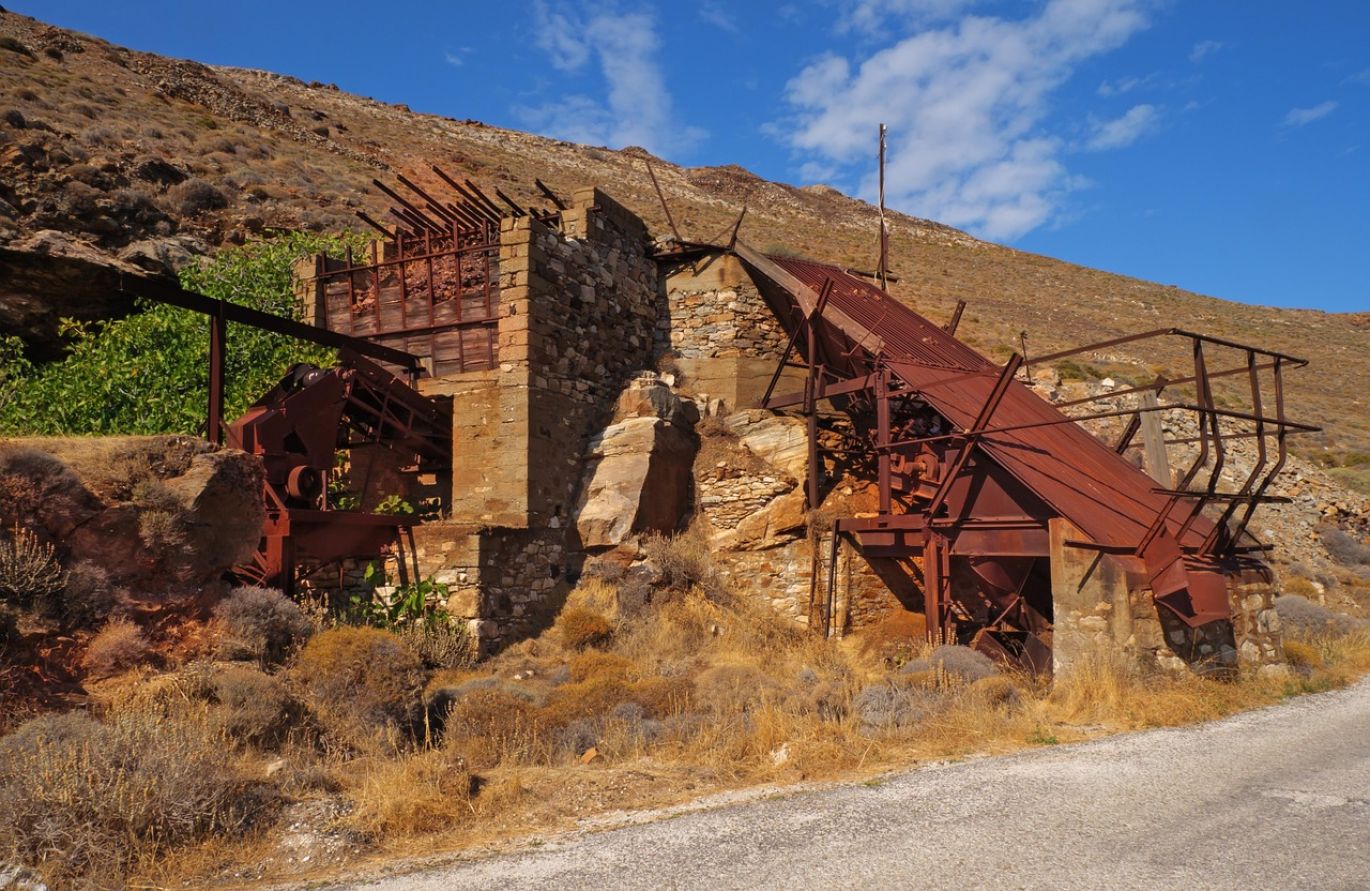 A large industrial crushing machine operating within an open-pit mine, crushing ore for efficient In Pit Crushing process.