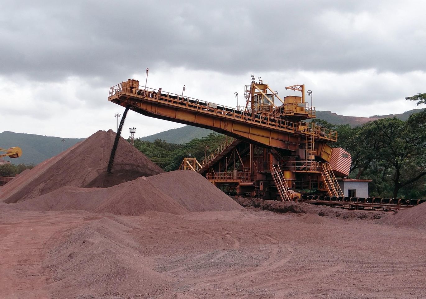Close-up of iron ore pellets ready for blast furnace in a steel manufacturing plant.