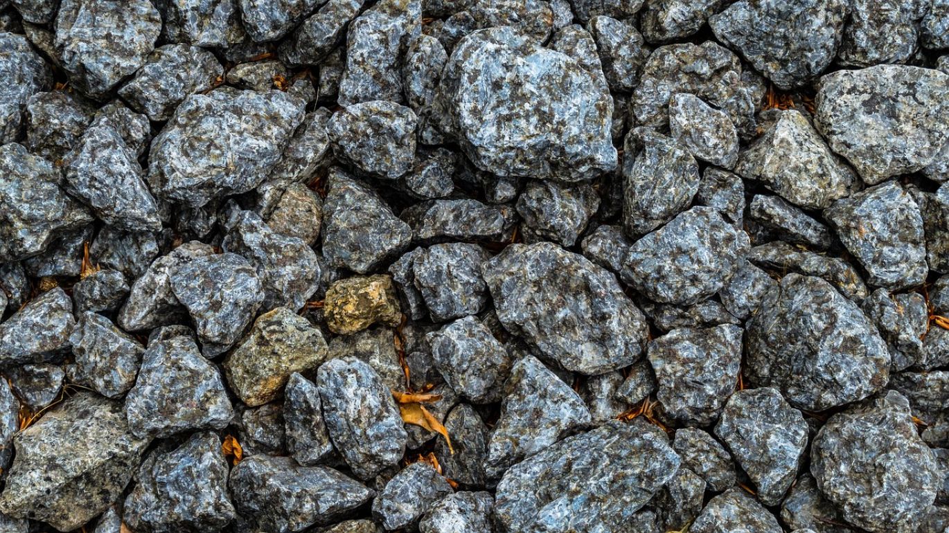 A high-quality sample of Iron Titanium Oxide (ilmenite) mineral, showcasing its texture and color, ready for industrial