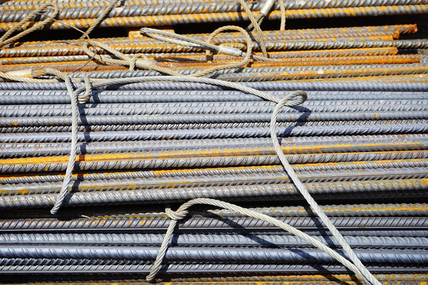 Iron used in construction: Close-up of strong steel beams on a construction site, showcasing structural integrity.