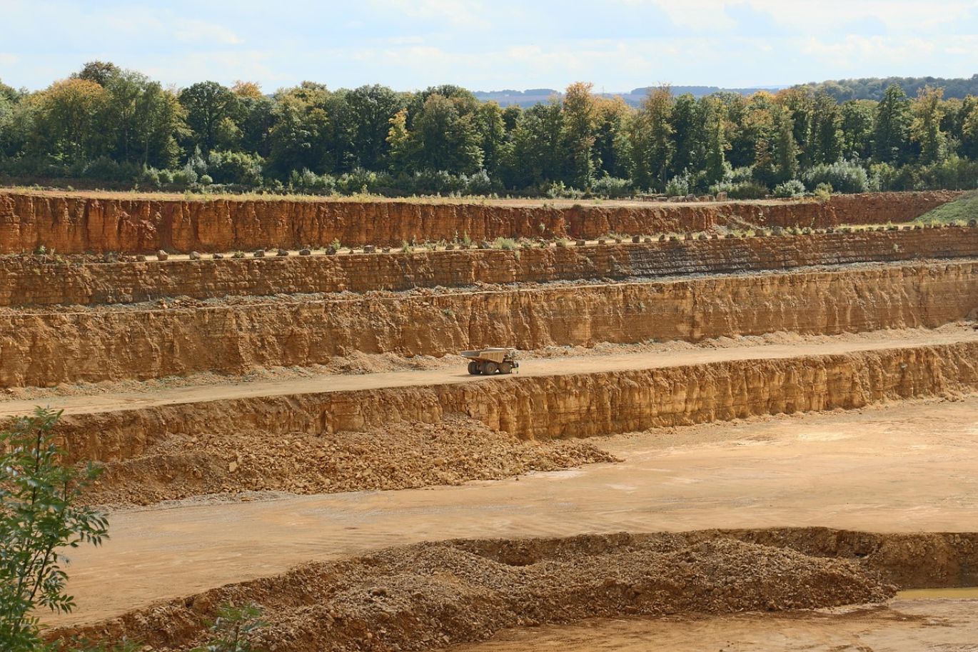 Open pit limestone mine in Kenya with heavy machinery