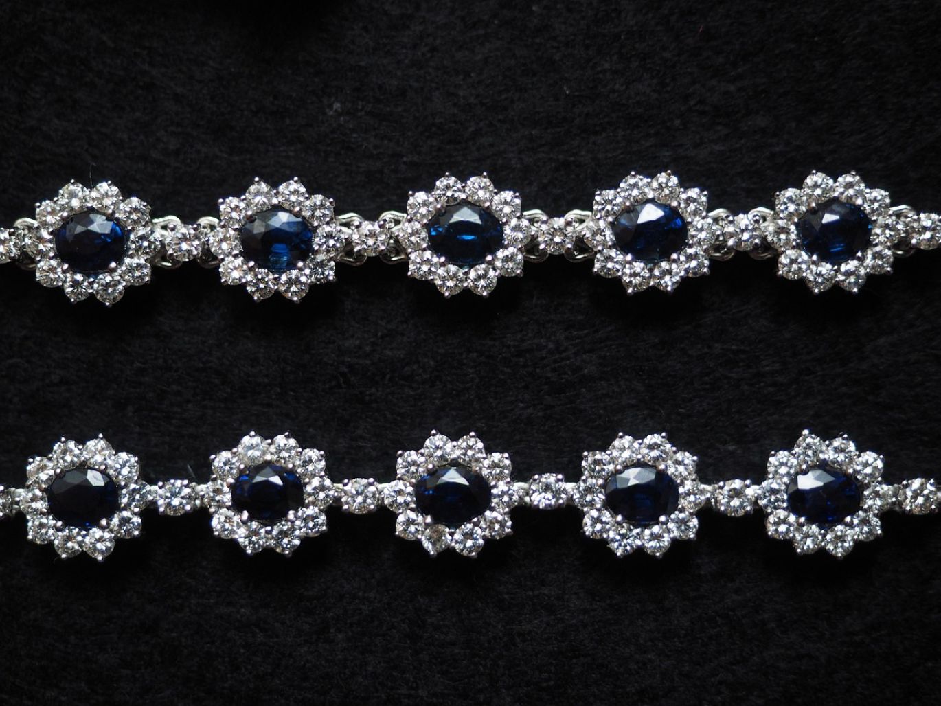 A collection of unpolished, loose sapphires in various shades of blue, ready for wholesale purchase from Maiyam Group.