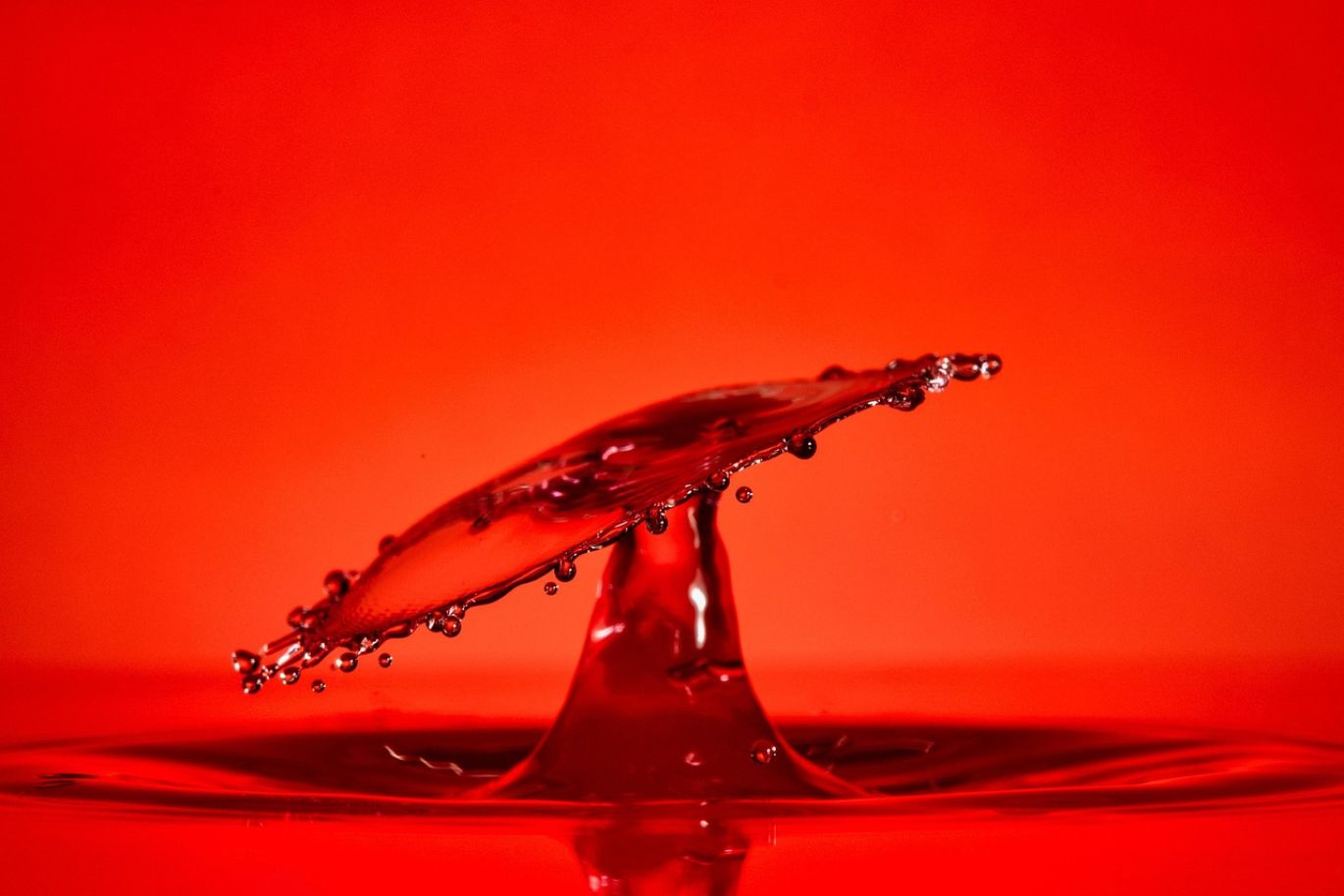 Close-up of a rock surface being etched by muriatic acid, showcasing industrial applications.