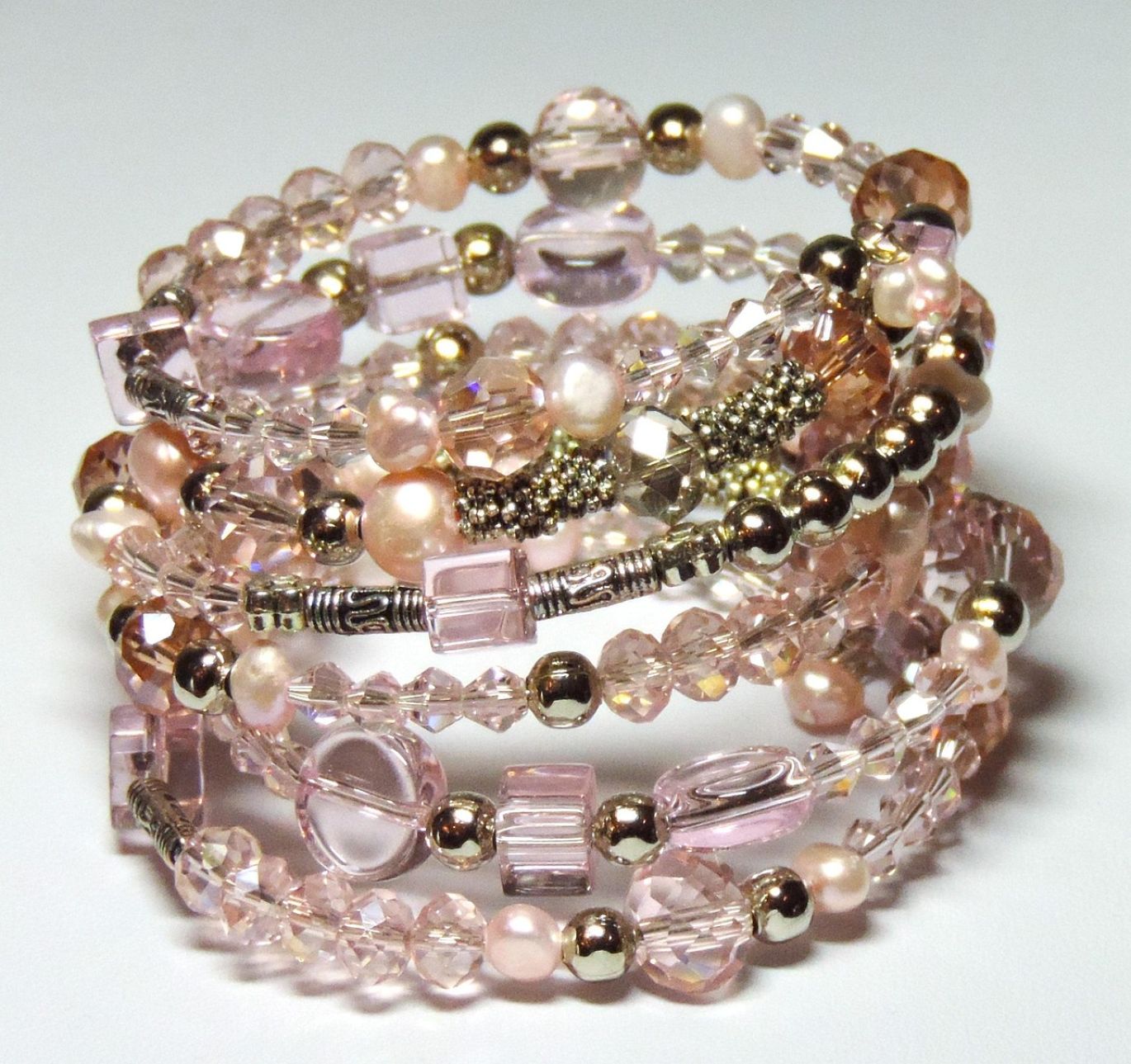 A selection of natural crystal beads in various colors and shapes, offered for wholesale by Maiyam Group in Kenya.