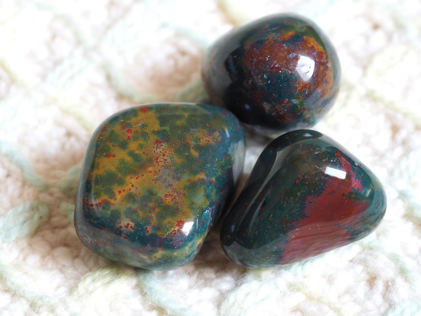 A collection of high-quality natural loose gemstones for wholesale from Kenya, showcasing sapphires, emeralds, and