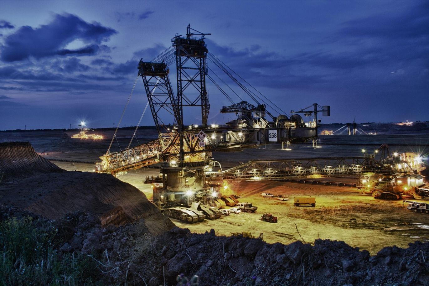 Aerial view of an open pit gold mine in Kenya, highlighting large-scale extraction operations managed by Maiyam Group.