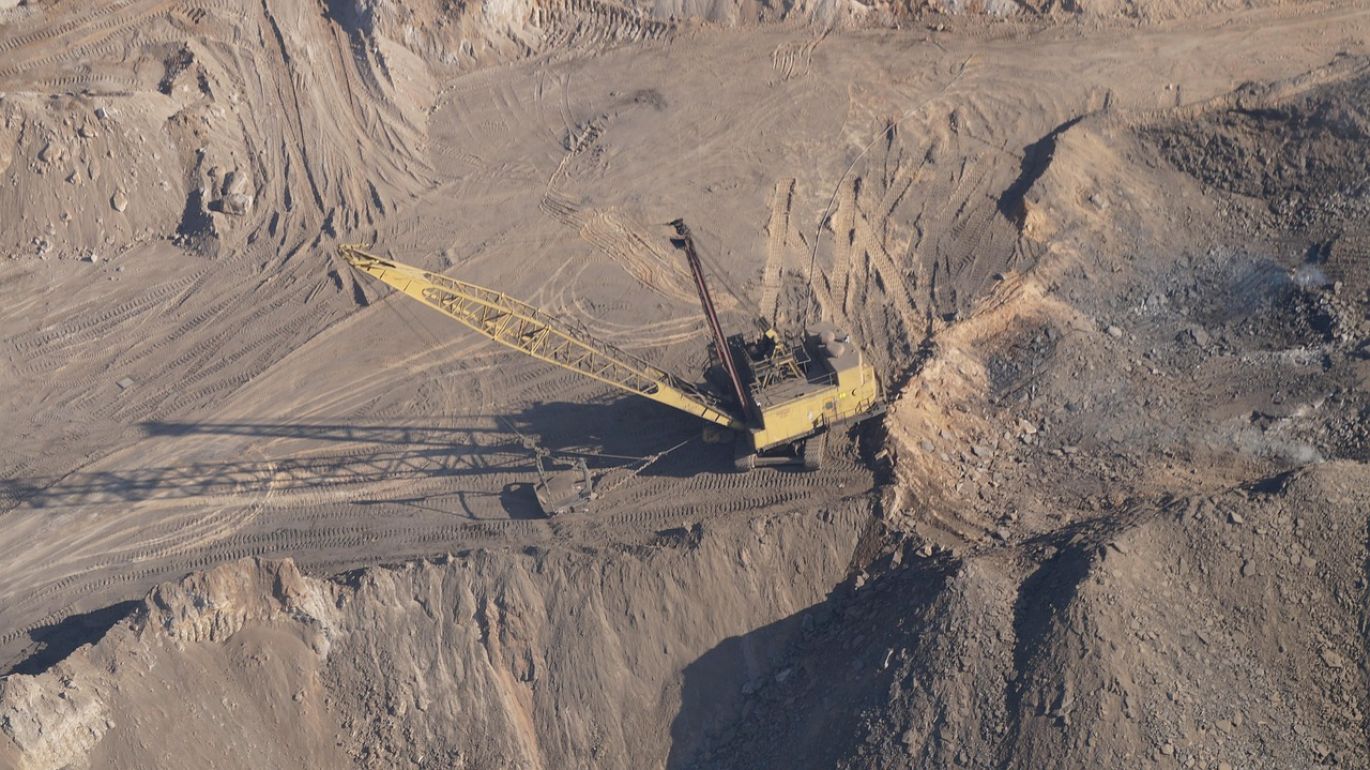Pile of raw rock phosphate, highlighting the essential nutrients it contains for agricultural use.