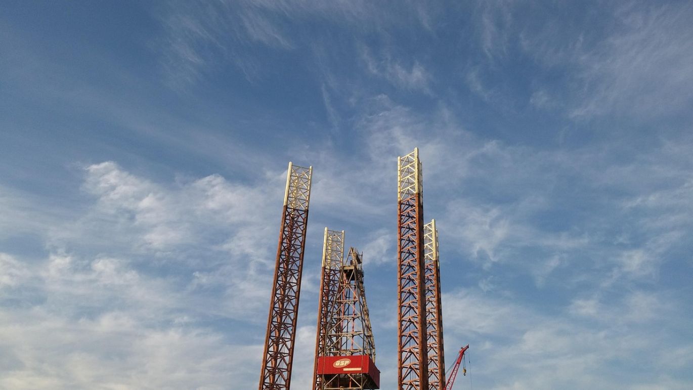Heavy-duty rotary drilling rig operating at a mine site for efficient mineral extraction.