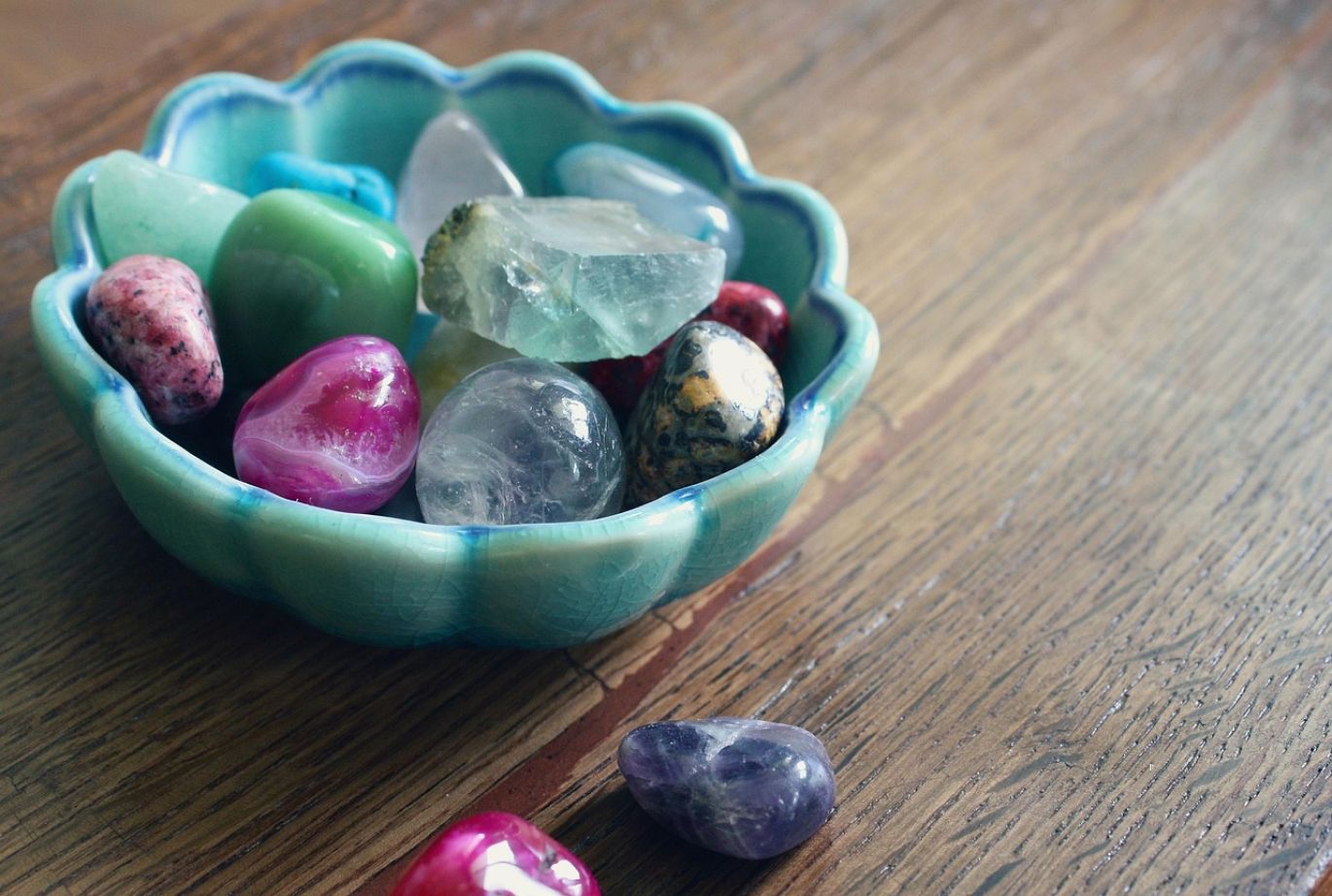 A vibrant assortment of bulk semi precious beads for wholesale, showcasing various colors and cuts, representing Semi