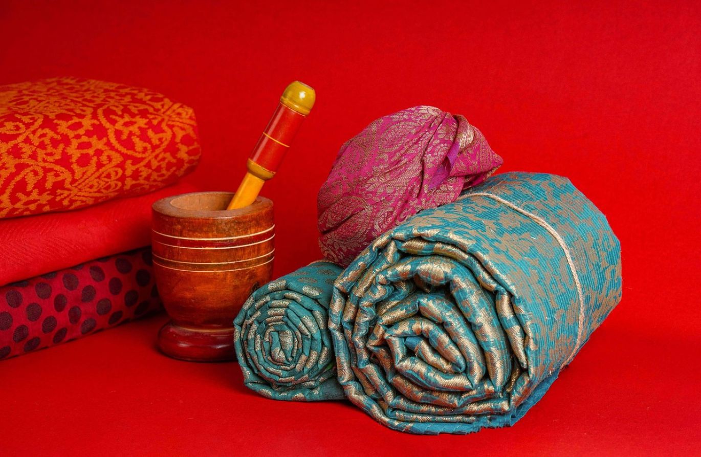 Close-up of colorful, abstract patterns on fabric created using Soda Ash Water Tie Dye method