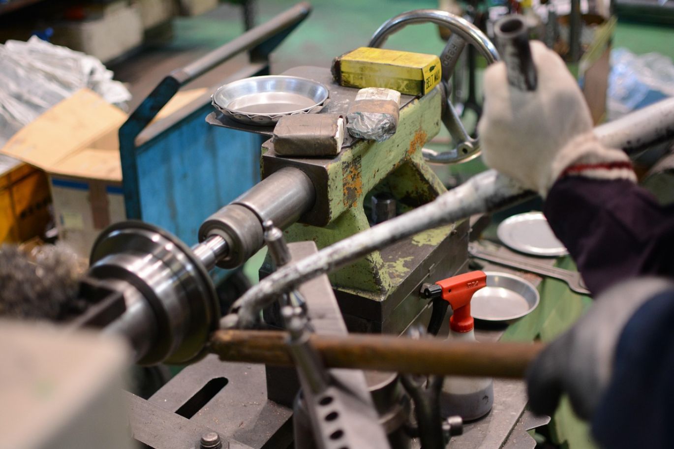 Close-up of molten glass being formed, highlighting the role of sodium carbonate used in glass manufacture.