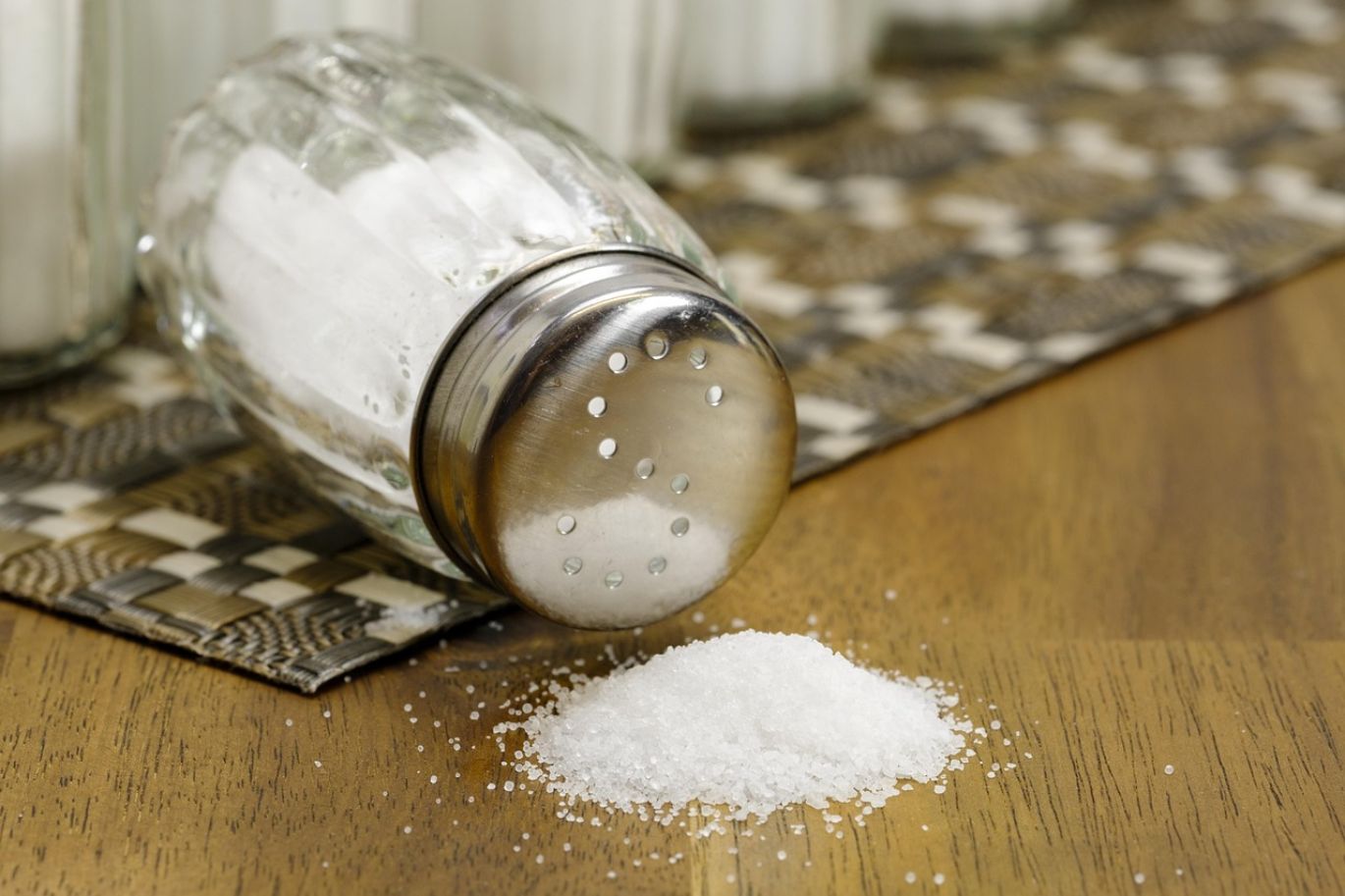 Bulk sodium chloride crystals being loaded for industrial use, highlighting competitive Sodium Chloride Bulk Price.