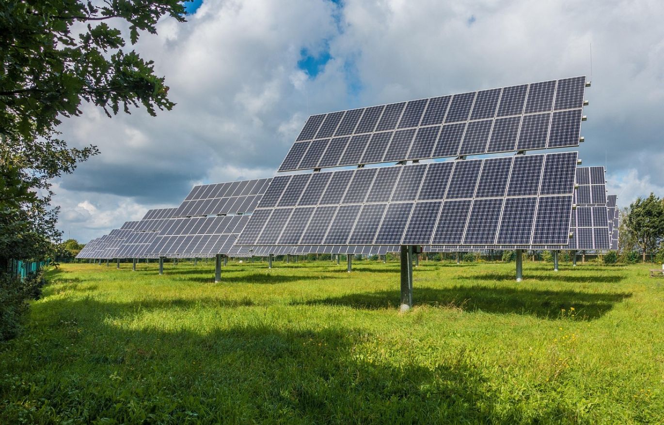 Illustration of solar panels powering mining equipment for Solar Energy Mining.
