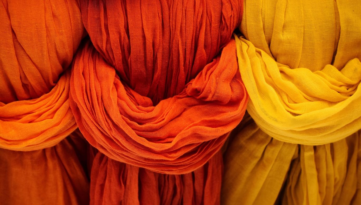 Close-up of vibrant tie-dye fabric showing enhanced color saturation, implying the use of a Tie Dye Fixer.