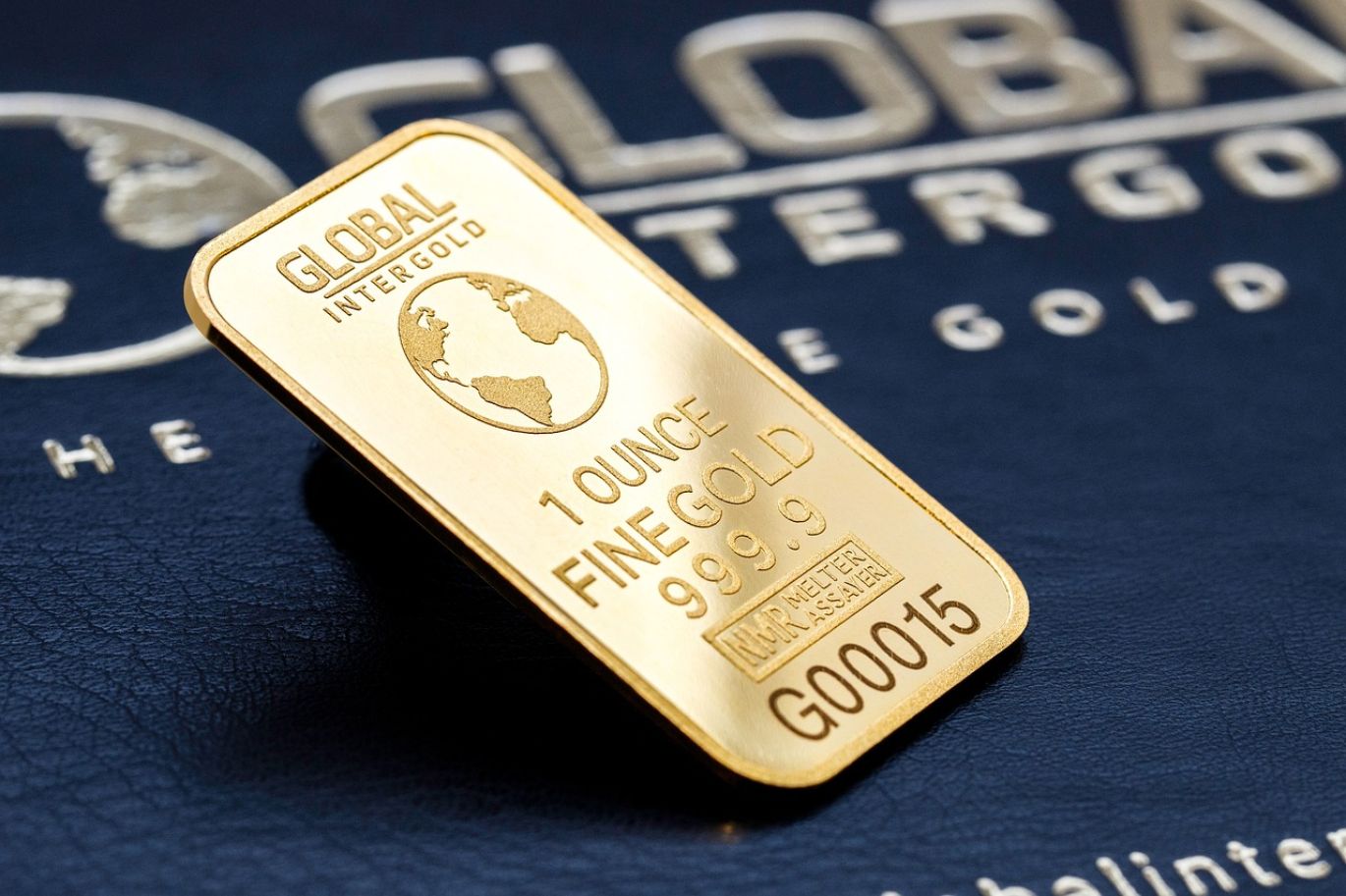 Close-up of refined gold bars representing Transcend Bullion, with a subtle background hinting at African landscapes and