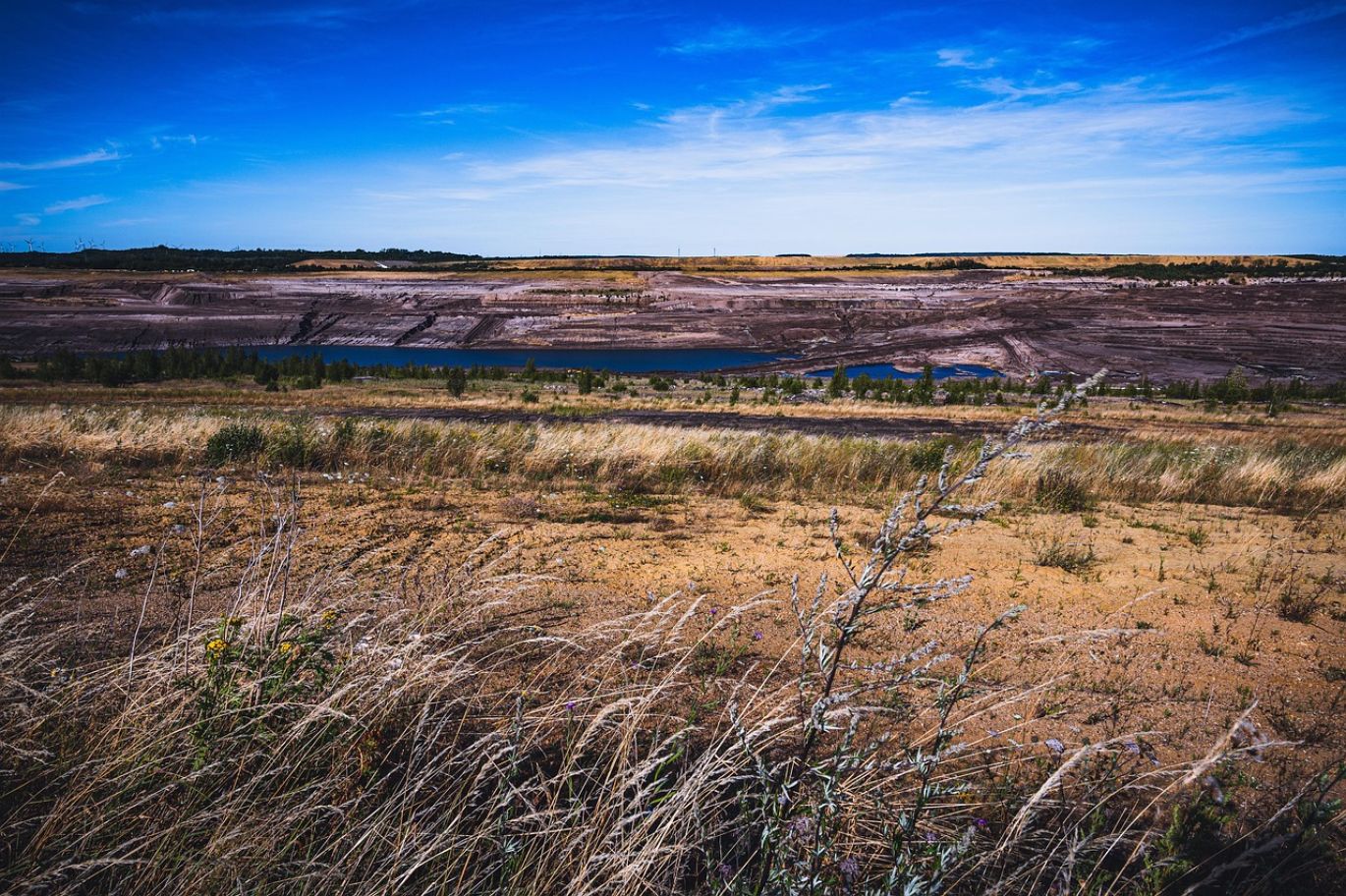 Aerial view of a modern coal mine operation, representing the Universal Coal Mine.